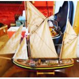 A painted wood model of a Brixham trawler