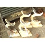 A set of four vintage painted cast iron rail brackets