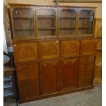 A 7' 3" 19th Century quarter sawn oak estate managers cupboard with two pairs of cupboard doors over