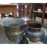 Two Middle Eastern copper pots with incised decoration- sold with a copper mallet shaped coffee