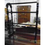 A reproduction stained wood double towel rail