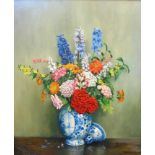 †A. L. Grace: an ornate gilt framed oil on canvas still life with spray of flowers in a Delft vase
