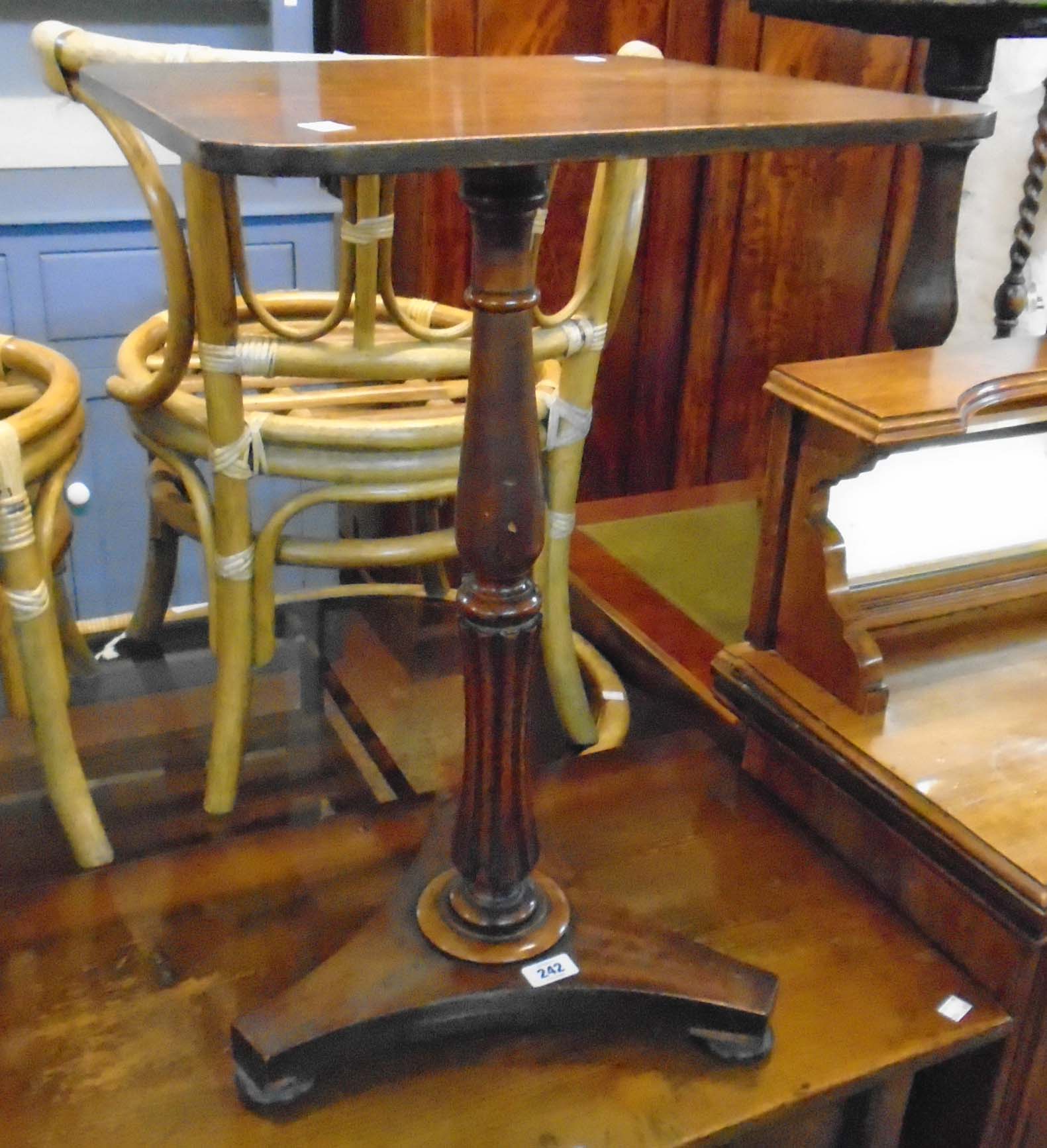 A 19th Century mahogany pedestal table, set on turned and reeded pillar with trefoil base and