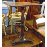 A 19th Century mahogany pedestal table, set on turned and reeded pillar with trefoil base and