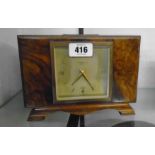 A mid 20th Century burr walnut veneered cased mantel timepiece retailed by J. W. Benson, London