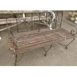 A wrought iron framed garden bench - length 5'