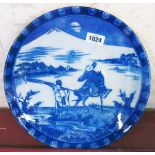 A 12" early 20th Century Japanese Yamatoku blue and white charger with Lgezara transfer scene of