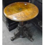 A 22" diameter antique oak pedestal table with incised decoration to top, set on a heavy incised