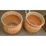 A pair of large terracotta garden pots