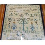 A late Georgian sampler by Elizabeth Barber and dated 1827, in original maple frame