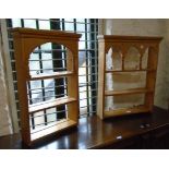 Two small waxed pine wall mounted three shelf open plate racks of similar arcaded design