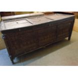 A 6' 2 1/2" antique North African hardwood marriage chest with studded strapwork and all-round