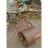 A large "The Crown" garden roller with cast iron handle