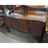 A 5' early 20th Century Georgian style mahogany serpentine front sideboard with low raised back,