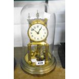 An early 20th Century anniversary clock under glass dome