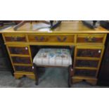 A 4' reproduction yew twin pedestal desk with three frieze drawers and six flanking pedestal