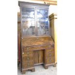 A 3' 6" antique mixed wood bureau bookcase with Greek key cornice to astragal glazed top over a