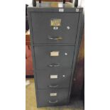 A vintage grey painted metal four drawer filing cabinet with key