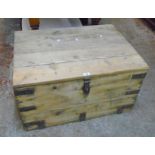 A 35" antique stripped pine lift-top box with heavy iron latch, carrying handles and bound corners