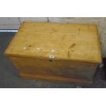 A 33 1/4" Victorian stripped pine lift-top box with flanking iron carrying handles