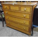A 3' 10" 19th Century polished mixed wood and strung chest of three short and three long graduated