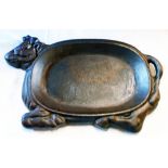 A cast iron dished tray in the form of a cow