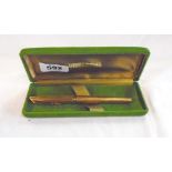 A boxed gold plated Waterman C/F fountain pen in barley corn finish with 18k nib