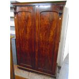 A 4' 3" 19th Century flame mahogany veneered double wardrobe with drawer fitted interior and hanging