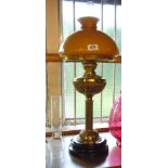 A Victorian brass table oil lamp by Sherwoods of Birmingham, with shade and chimney - sold with a