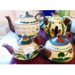 A large Longpark Pottery teapot, udder vase and two further small teapots