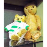 A vintage jointed Teddy bear with patched paws, much loved - sold with a smaller Teddy with