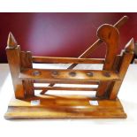 An early 20th Century stained wood novelty pipe rack in the form of a five bar gate