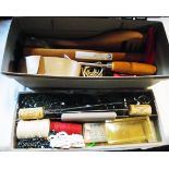 A box containing a quantity of upholsterers tools including hammer, webbing stretchers, staple