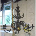 A Prussian brass eight branch chandelier