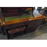 A 3' 9" reproduction stained wood single pedestal computer desk with leather inset top, fall-front