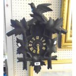 A vintage stained and carved wood cuckoo clock - one numeral and weight loop missing