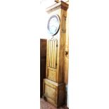 A 8' 8" 19th Century stripped pine longcase clock case with a 16" diameter dial marked for J.