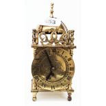 A small vintage Smiths brass lantern style timepiece with mechanical movement
