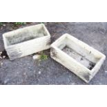 A pair of concrete rectangular planters