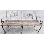 A wrought iron framed garden bench - length 5'
