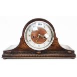 An early 20th Century polished oak cased Napoleon hat mantel clock with Smiths eight day gong