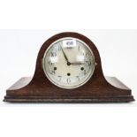 A 20th Century polished oak cased Napoleon hat mantel clock with German Haller eight day chiming