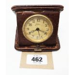 An early 20th Century leather cased travelling clock with Junghans timepiece movement