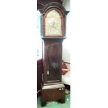 An early 19th Century mahogany longcase clock with break arch hood, the 12" arched brass dial with