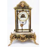 A 19th Century French green onyx and brassed metal mounted four glass salon mantel clock with