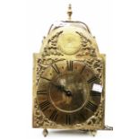 A 14" high antique brass wall mounted lantern clock, the 7" arched dial marked Geo. Rowning,