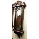 An early 20th Century stained wood cased Vienna style regulator wall clock with architectural