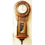 An American stained wood cased regulator wall clock with profuse floral carved and pierced