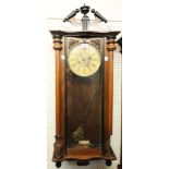 A late 19th Century walnut and part ebonised cased Vienna style regulator wall clock with decorative