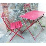 A painted metal framed bistro table and pair of chairs